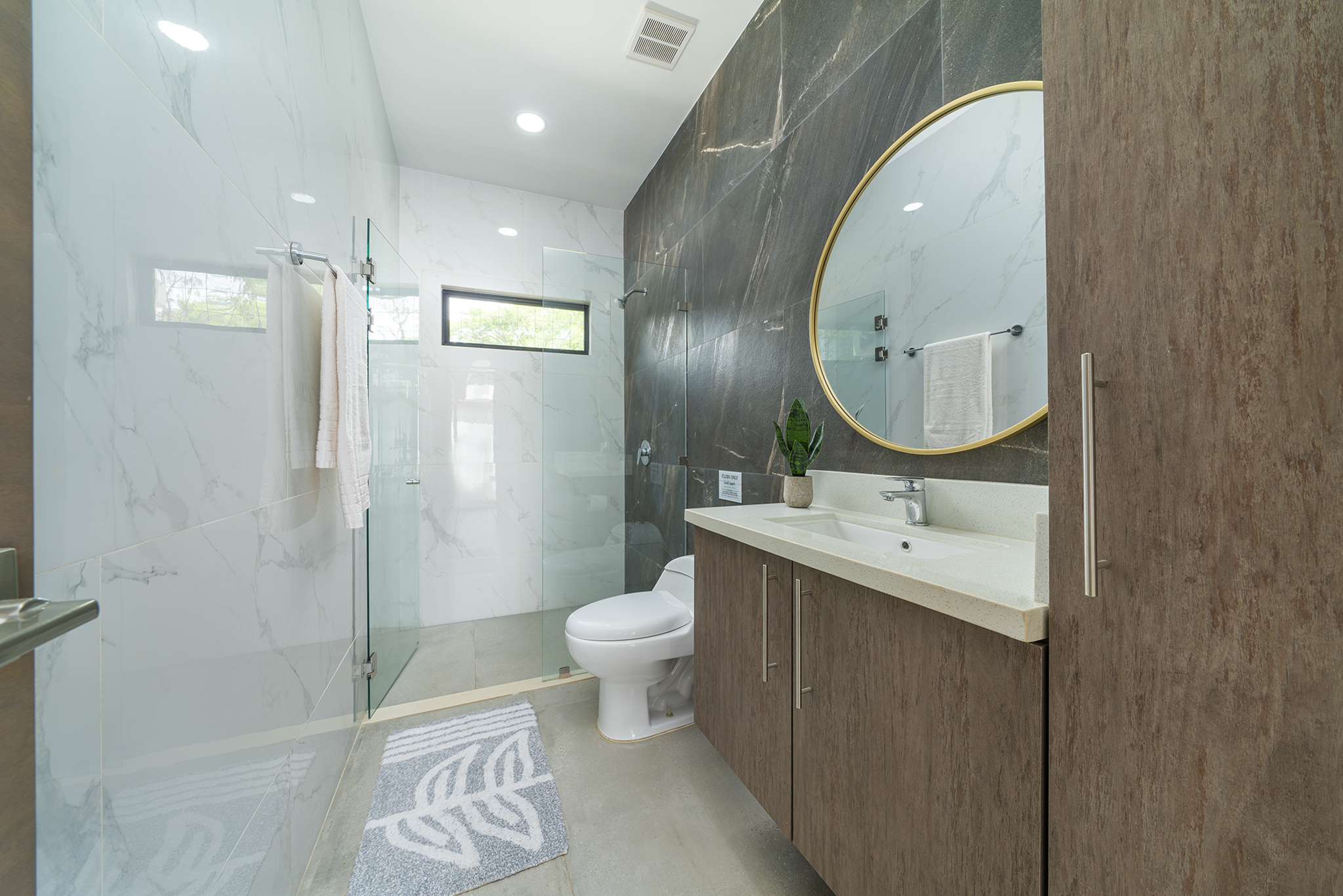 Guest bathroom — marble & gold mirror