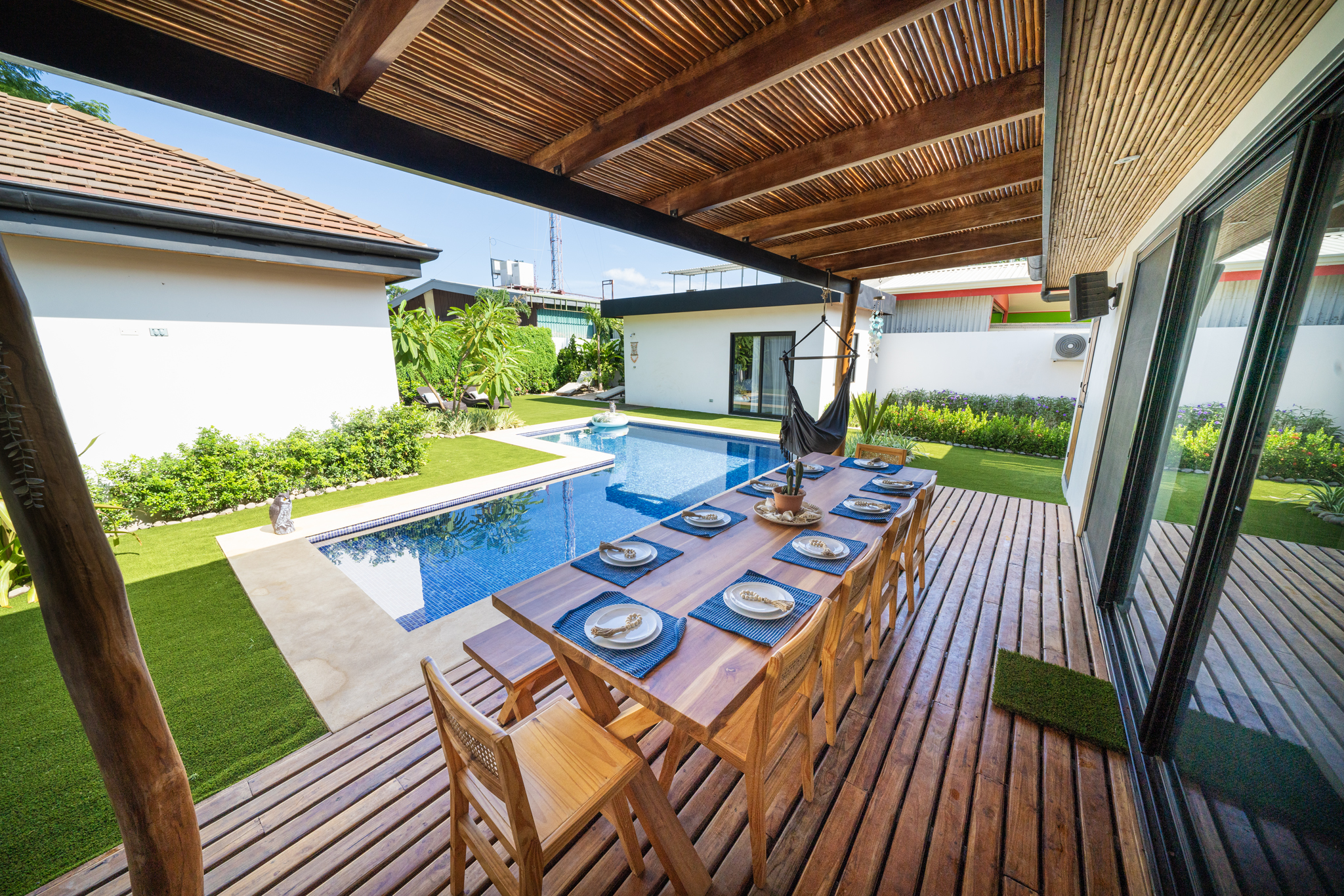 Outdoor dining table overlooking pool