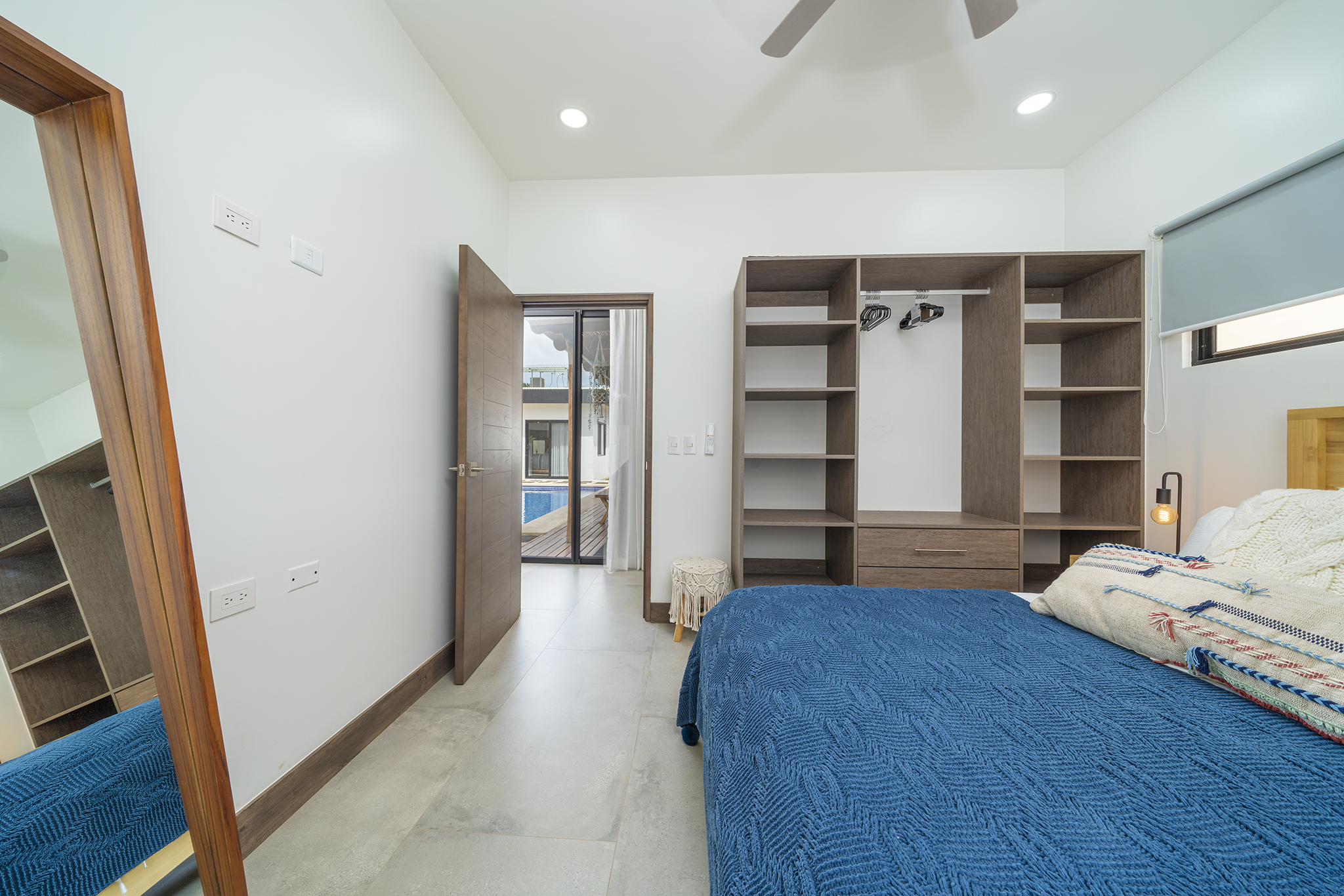 Guest bedroom with pool-view door